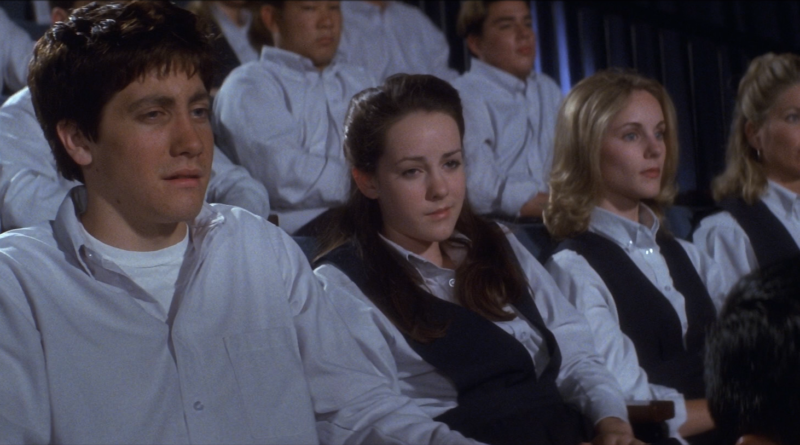 Donnie and Gretchen sit together during a school assembly in Donnie Darko.
