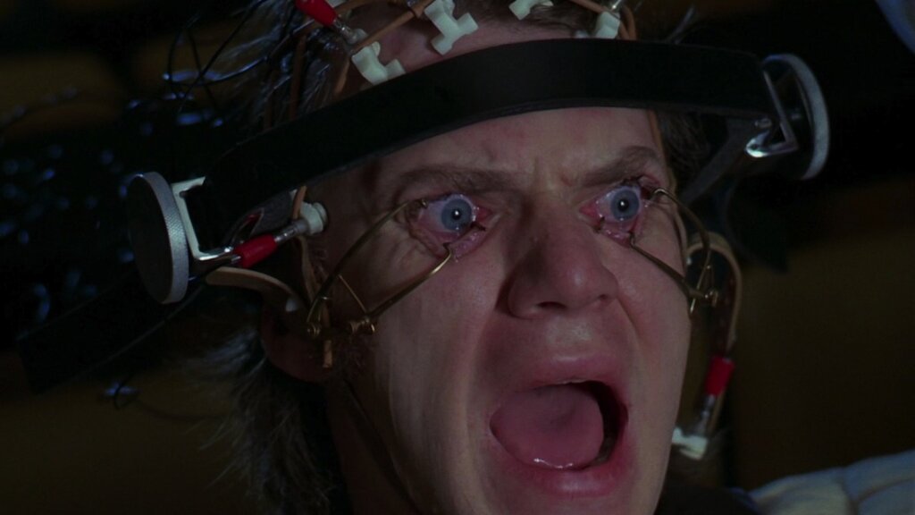 Alex is restrained with his eyelids forced open during the Ludovico treatment in A Clockwork Orange.
