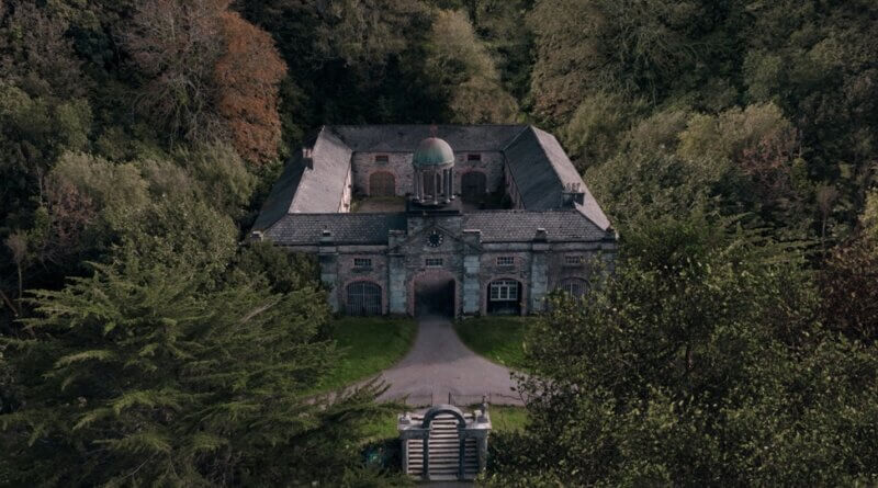The isolated stone house surrounded by dense woodland in Oddity