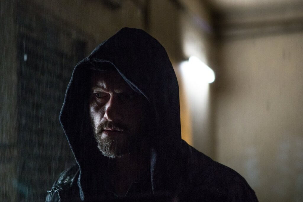 James Lasombra investigates a dim corridor in The Empty Man (2020)