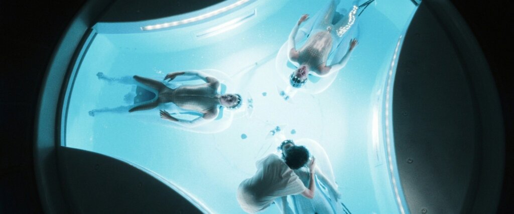 The three Precogs float in the illuminated chamber used by Precrime in Minority Report.