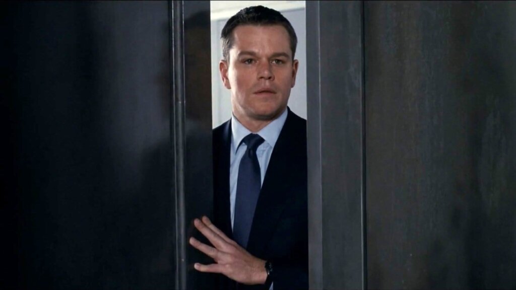 David Norris peers through a partially opened door in The Adjustment Bureau.