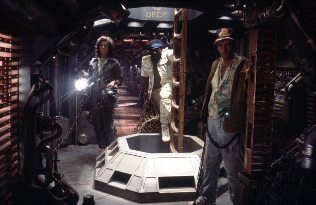 Ripley, Parker, and Brett search the Nostromo in Alien (1979)