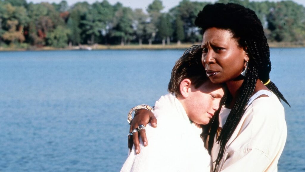 Clara holds David beside the lake in Clara’s Heart (1988).