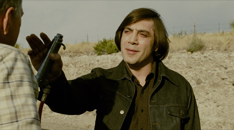 No_Country_for_Old_Men_01_Featured_Chigurh_Roadside.jpg Anton Chigurh confronts a driver on a sunlit Texas roadside.