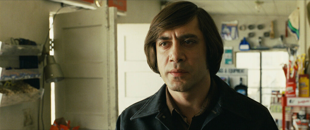 No_Country_for_Old_Men_03_Chigurh_at_Gas_Station.jpg Anton Chigurh faces the proprietor inside the gas station.