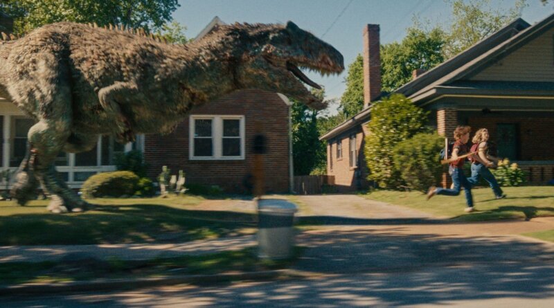 A feathered dinosaur chases the Platt family past a suburban brick house in The End of Oak Street.