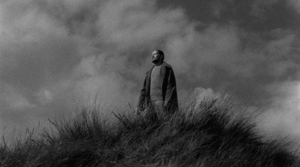A man in a field in Ordet.