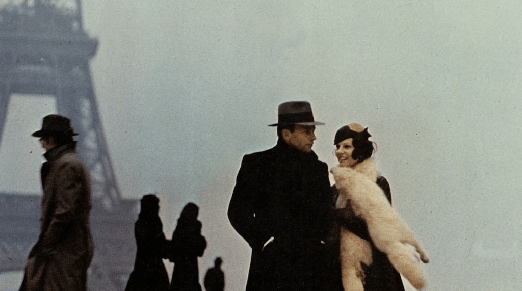 Marcello and Giulia stand near the Eiffel Tower in The Conformist.
