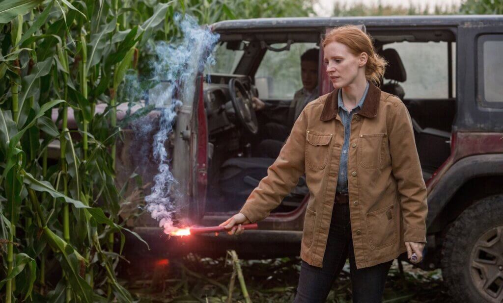 Adult Murph holds a flare near the family farm in Interstellar